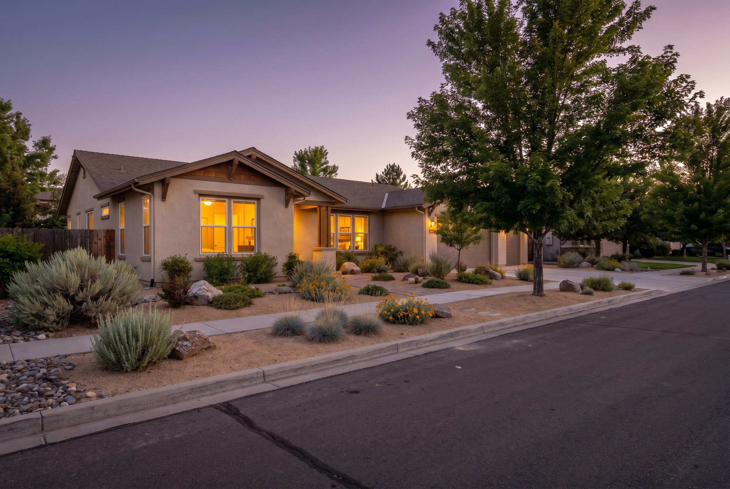 An Arizona home at dusk with warm glowing interior lights